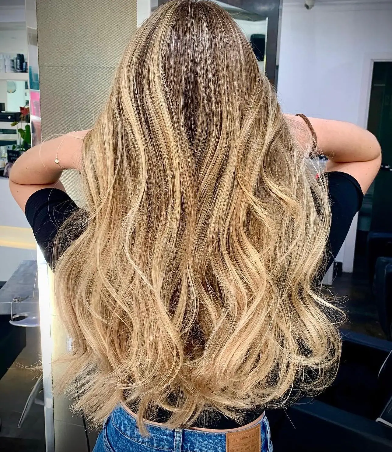 Long blonde balayage with voluminous waves