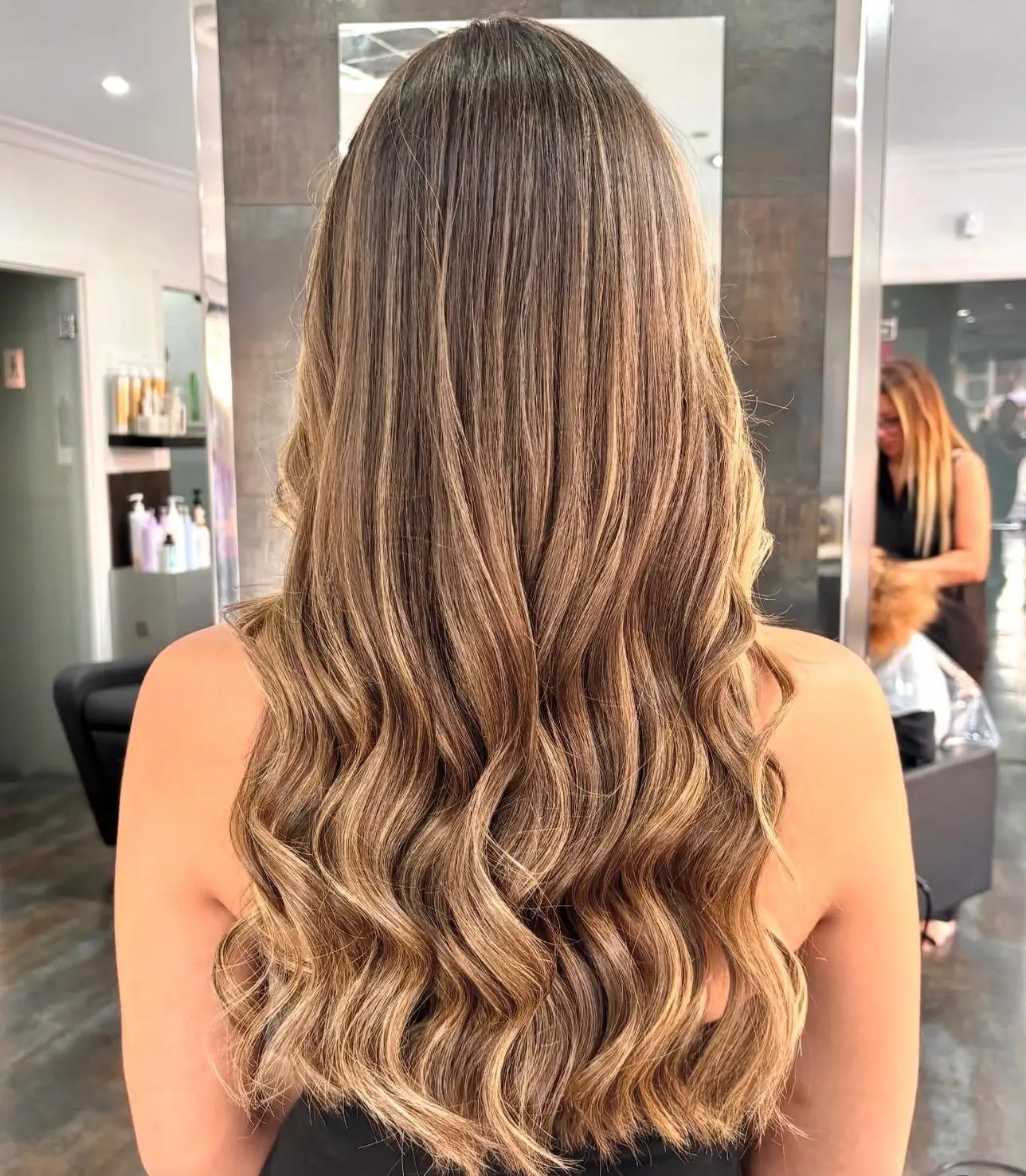 Honey highlighted waves styled at the salon