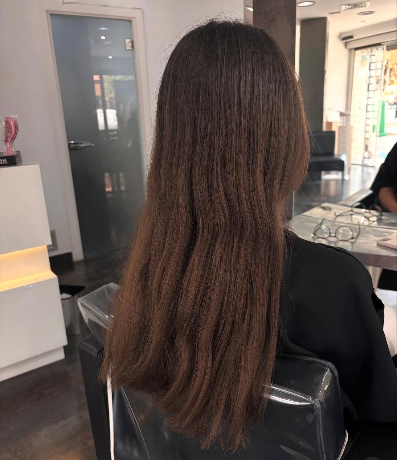 Long chocolate brown hair with soft layers