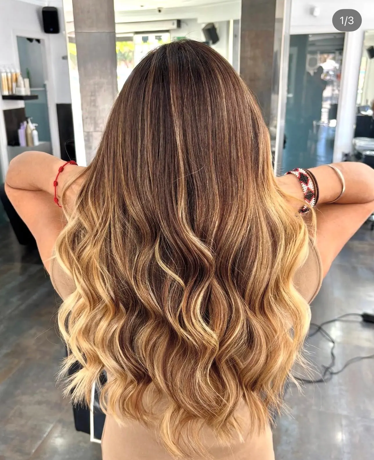 Dimensional blonde balayage with polished waves